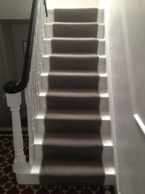 the carpeted stairs in this house are clean and ready for us to walk down