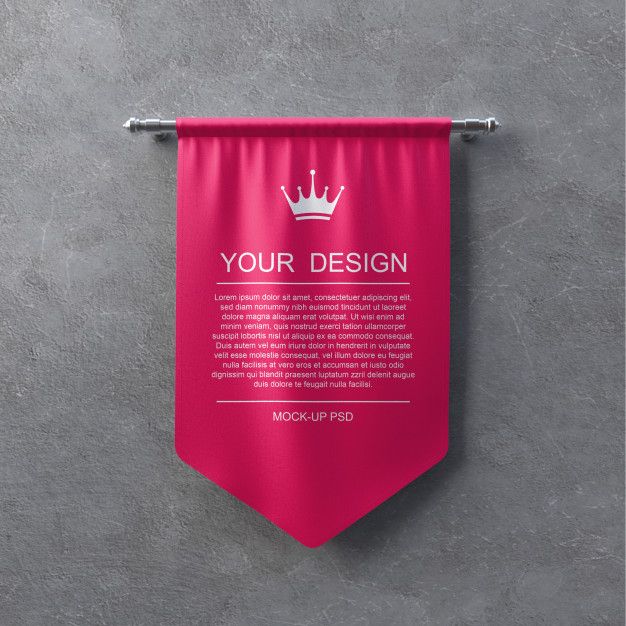 a pink banner hanging on the side of a wall with a crown and text below it