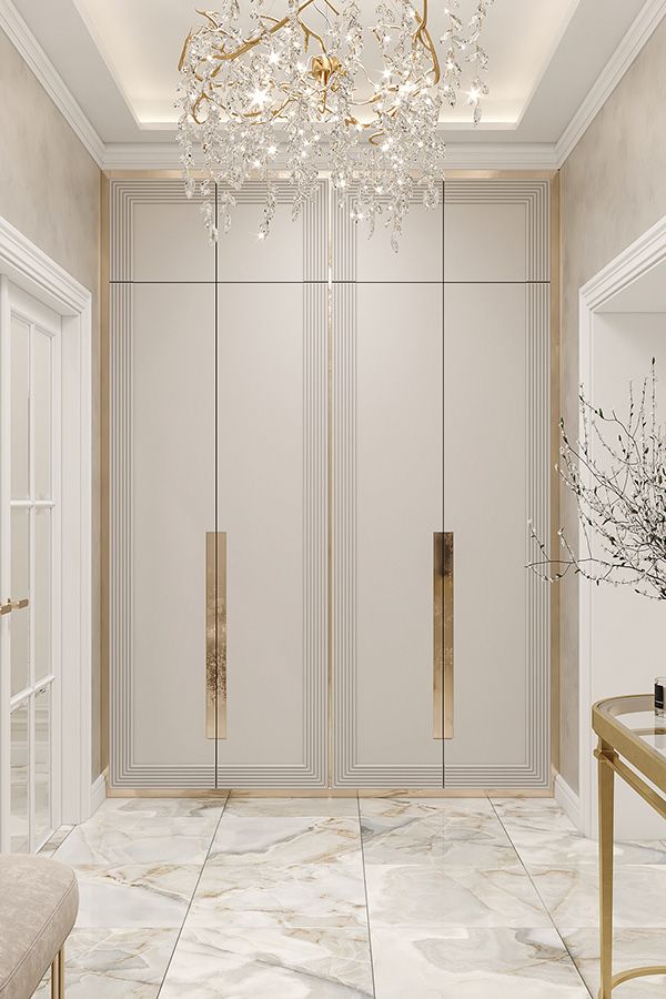 an elegant foyer with chandelier and marble flooring is featured in this rendering