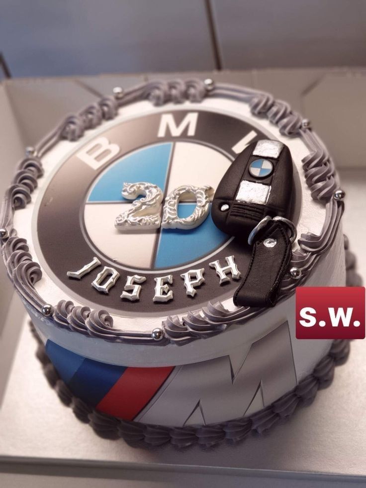 a birthday cake with the number twenty five on it and bmw emblem in the middle