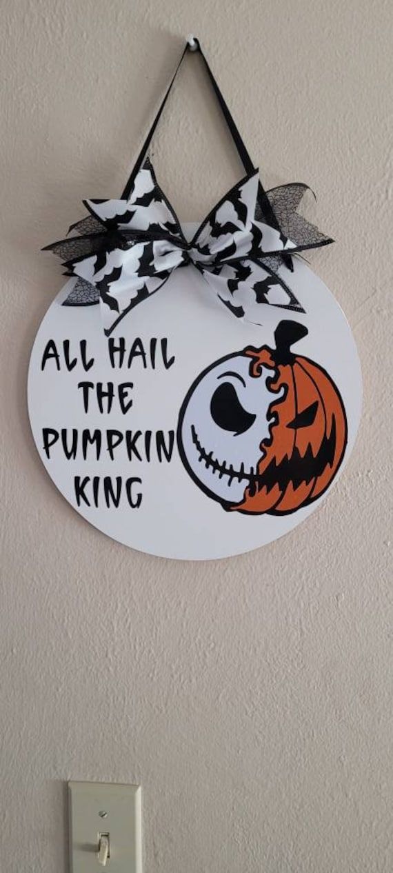 a sign that says, all hail the pumpkin king on it with a jack - o'- lantern