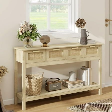 a wooden table with baskets on it in front of a white door and windowsill