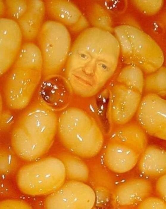 an image of a man that is in some kind of bowl full of food with something on it