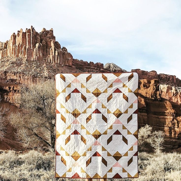 a quilt is hanging out in the desert