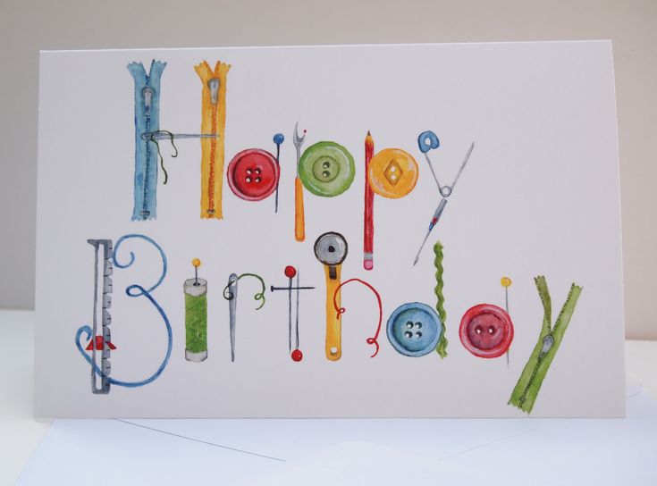 a birthday card with buttons and sewing needles