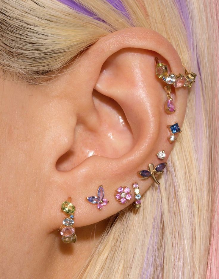 a close up of a person with ear piercings