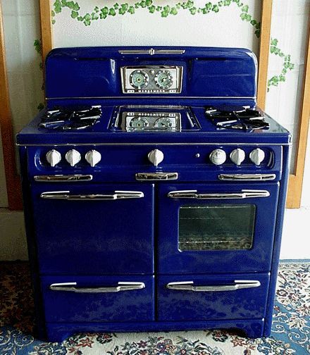 an old fashioned blue stove with two ovens