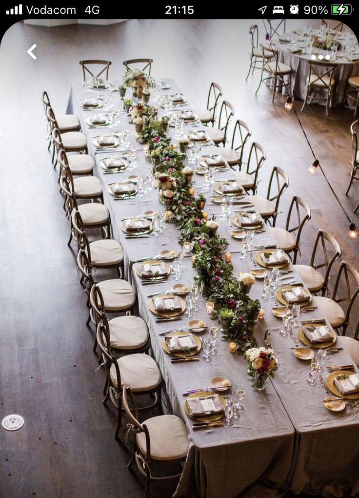 an overhead view of a long table set with place settings