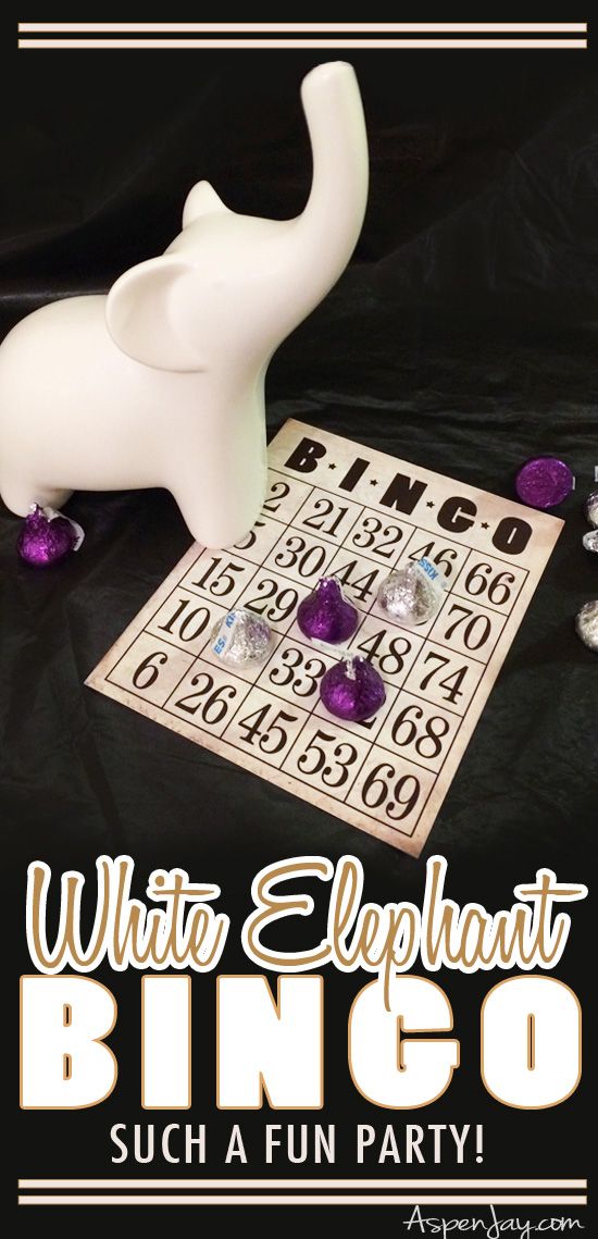 an elephant is sitting on top of a game board with purple candies around it