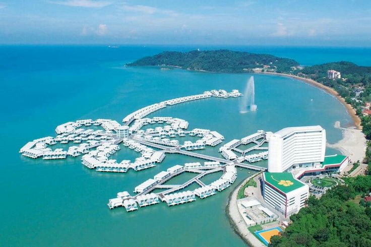 an aerial view of a resort and water park in the middle of a body of water