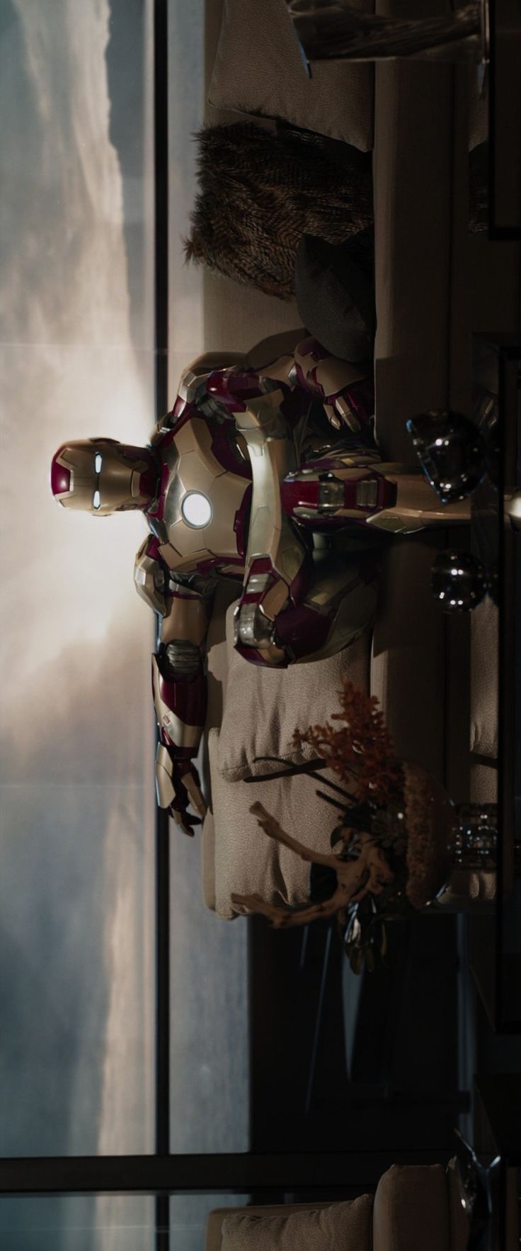 the iron man statue is in front of a window