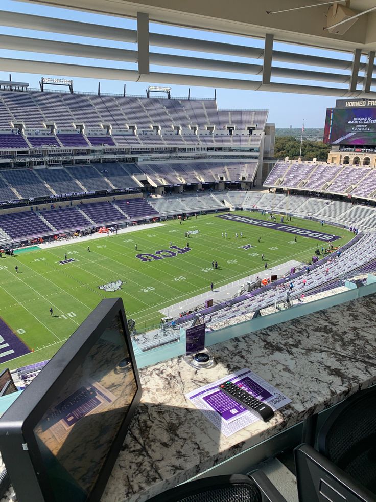 an empty football stadium filled with lots of people