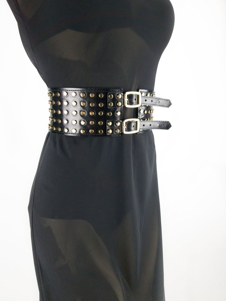 This 3in (8cm ) wide belt with metal buckles and gold metal studs is made of stiff calf leather with a gloss finish. With to its unique design, this belt will accentuate the waist and create a flattering feminine shape. This belt will fit many styles - Steampunk, Biker, Goth, Punk, Cowboy. You can wear this corset belt with dresses and blouses, it can even be worn over a cloak or jacket. Add this fashionable item to your wardrobe and you will not leave anyone indifferent! Other models of wide wa Punk Cowboy, Festival Cowgirl, Cowgirl Belt, Steampunk Festival, Cowgirl Belts, Bling Belts, Minimal Wardrobe, Leather Peplum, Waist Corset