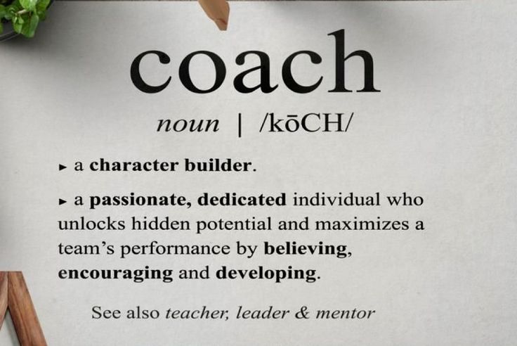 a piece of paper with the words coach on it next to a plant and scissors