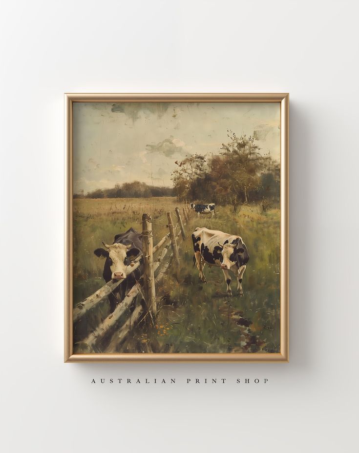 a painting of cows in a field behind a wooden fence with the words australian print shop below it