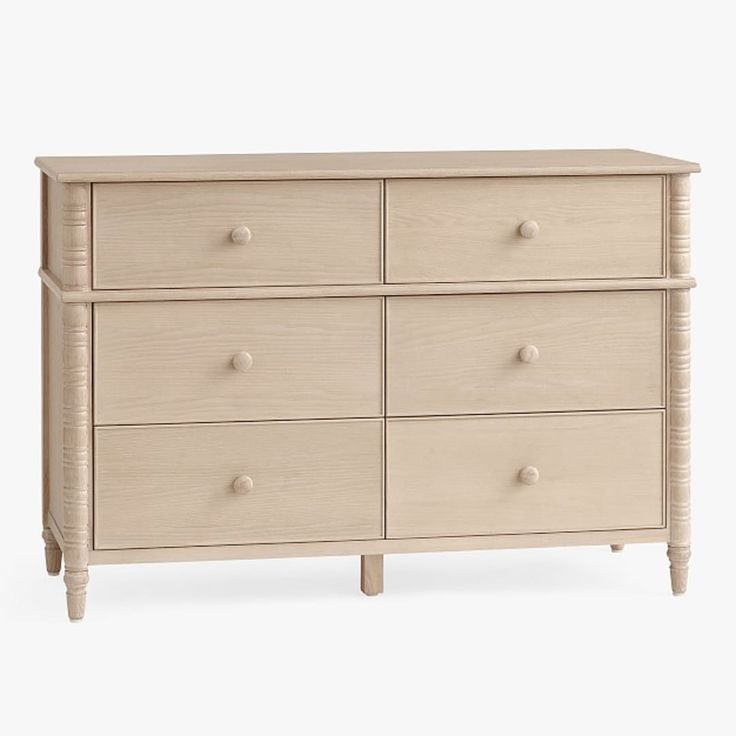 a white dresser with six drawers and two handles on each drawer, against a white background