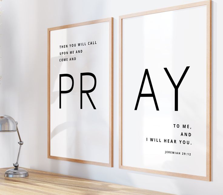 two framed posters with the words pray on them