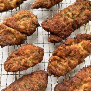 several pieces of fried food on a wire rack