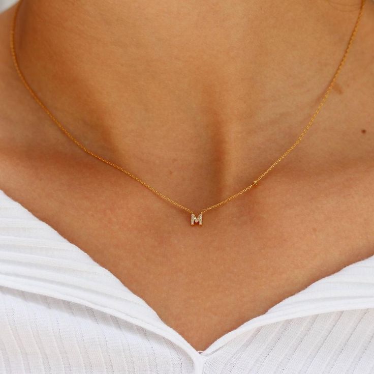 Add a personalized touch with our Dainty Mini Initials Necklace, featuring delicate gold initials encrusted with shimmering pave crystals. This elegant and minimalist design is perfect for everyday wear or special occasions, making it a versatile and meaningful accessory. Elevate your style with this chic and sophisticated necklace, ideal for adding a subtle sparkle and personal flair to your ensemble. Made with 100% recycled Sterling Silver base with a thick layer of high quality 14k gold plati Couples Necklace, Tai Jewelry, Bday Wishlist, Fall Fishing, Gold Pendent, Wedding Shopping, Minimal Gold, Picture Necklace, Bracelet Tennis