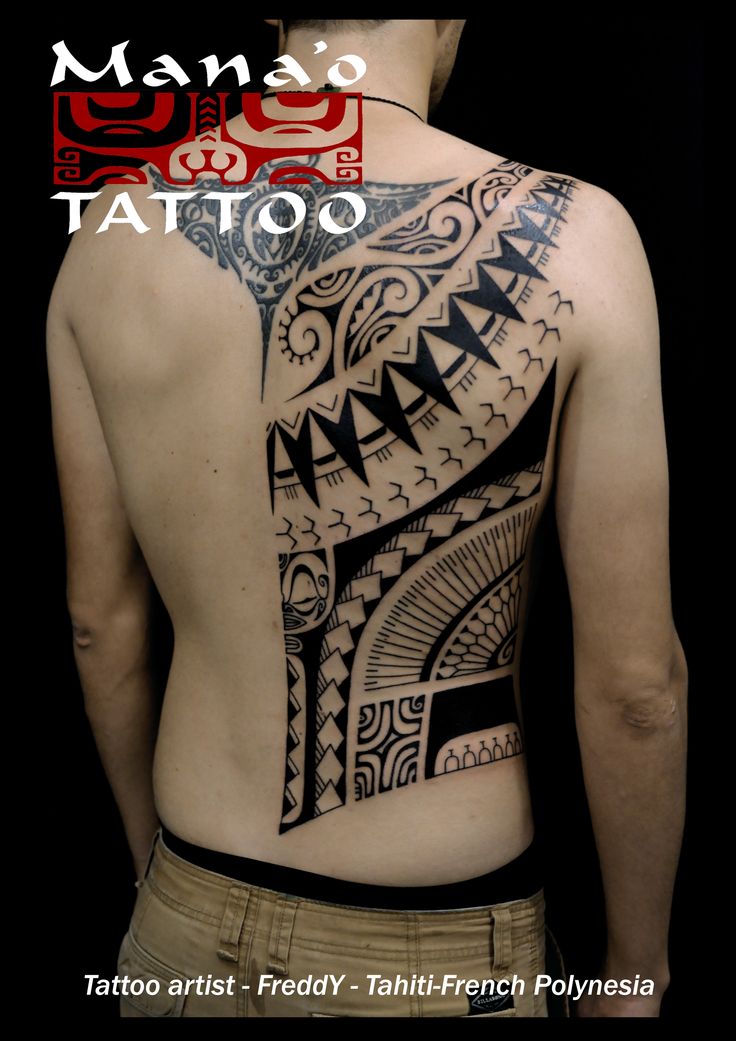 a man with a tattoo on his back