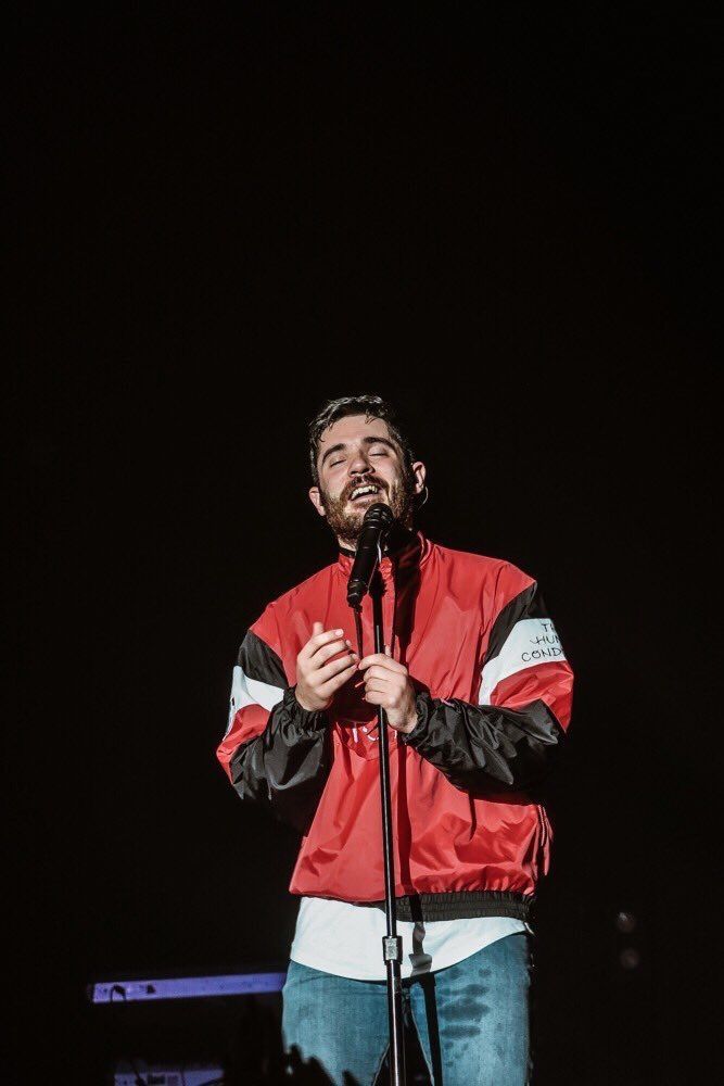 a man standing in front of a microphone