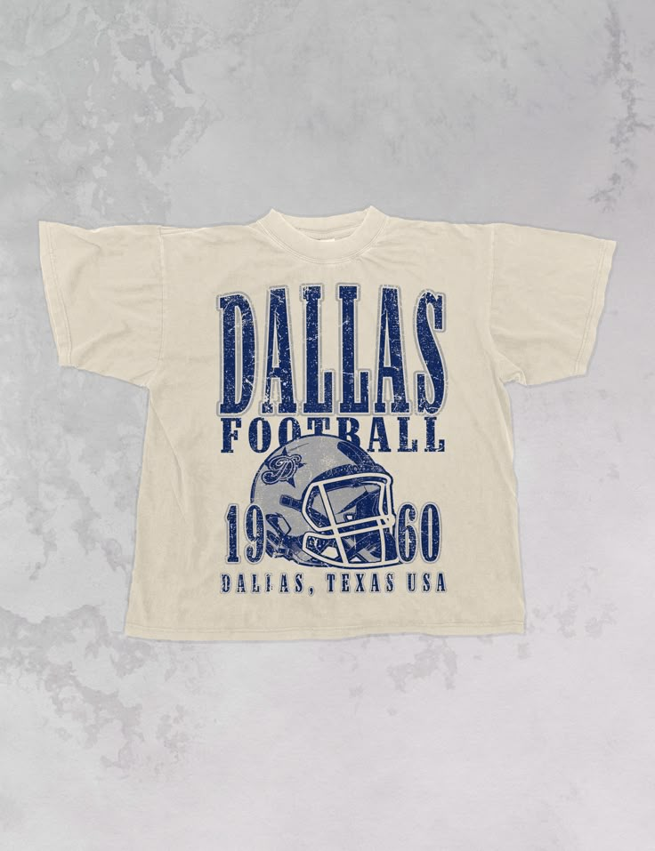 Show the love for your favorite team in this Dallas Football oversized tshirt that is inspired by vintage 90s N F L tshirts!- Features Dallas Football across the top with a football helmet and 1960 with Dallas, Texas USA underneath all in a navy and grey ink- Screen print transfer that is heat pressed onto each tshirt- Tshirt is a super soft vintage wash that gets softer after each wash- Oversized fit- Sizing translation: XS/S - L , S/M - XL , L/XL - 2XL , 2XL/3XL - 3XL * colors may vary slightl College Graphic Tees, Sorority Football Shirts, Vintage Sports Shirts, Vintage Sports Tees, Tshirt Merch Design, Spirit Shirt Ideas, College Tshirt Designs, Vintage Oversized Tshirt, Vintage College Shirts