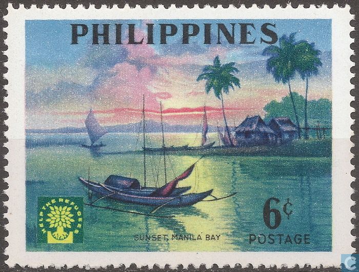 a stamp with an image of boats on the water and palm trees in the background