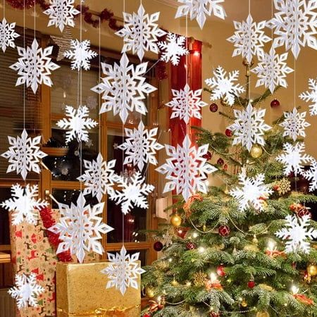 a christmas tree with snowflakes hanging from it