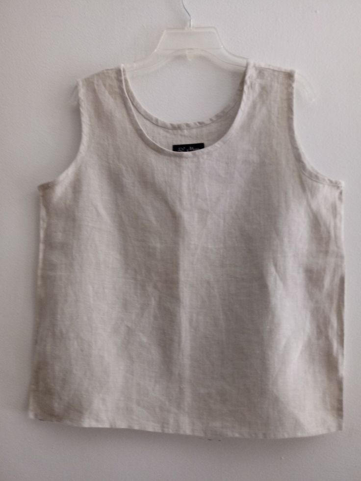 "Natural 100%  Linen/  casual tank top, scoop neck , side slits . Handmade from washed and soft medium weight. We wash and dry our products several times to achieve the maximum softness of the fabric and emphasize its natural structure. Armholes and neck with self  natural bias. Medium weight linen/rayon  Loose fit. Wide straps Soft and comfortable. Pre-washed / pre-shrunk Note that colors may look different on your display depending on their settings and technical characteristic SIZE MEDIUM : G Casual Flax Linen Tank Top, Neutral Cotton Tank Top, Summer Linen Tops With Scoop Neck, Summer Linen Top With Scoop Neck, Casual Sleeveless Top With Natural Dye, Casual Sleeveless Eco-friendly Top, Scoop Neck Linen Top For Summer, Everyday Neutral Linen Top, White Linen Tank Top For Everyday