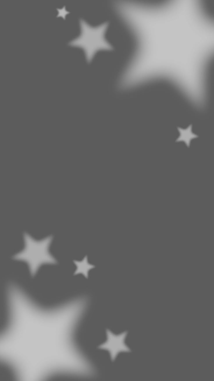 an abstract background with white stars on a black and gray background, for use as a backdrop or wallpaper