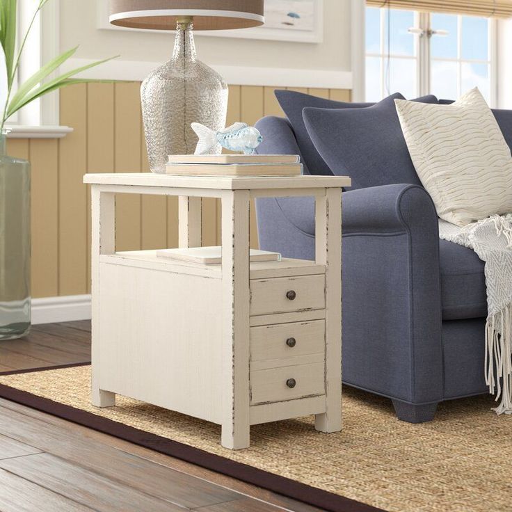 a living room scene with focus on the end table and couch in the foreground