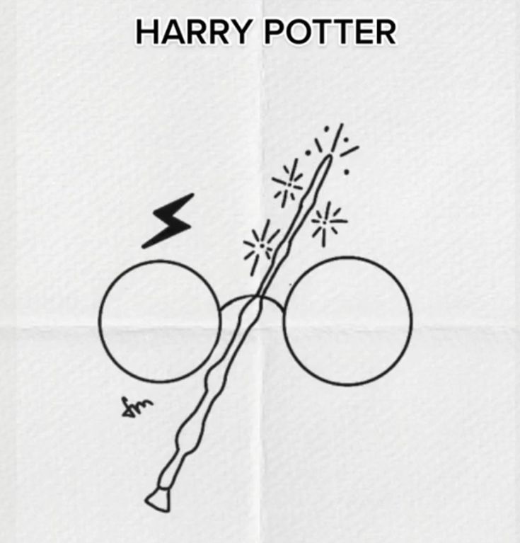 the harry potter logo is drawn on a piece of paper with an arrow pointing to it