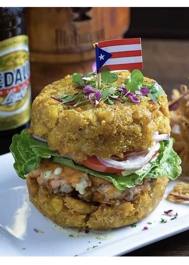 a fried chicken sandwich with an american flag on top