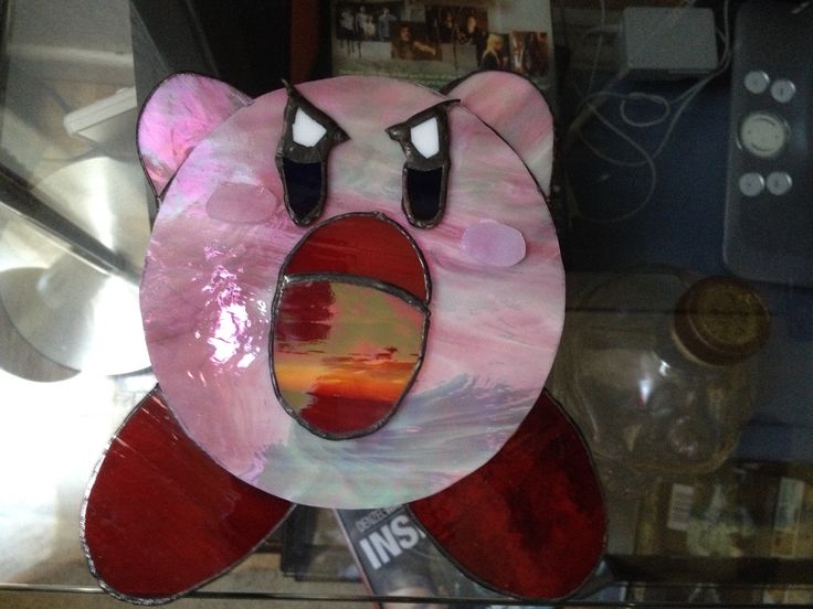 a pink and red bear shaped paper mache