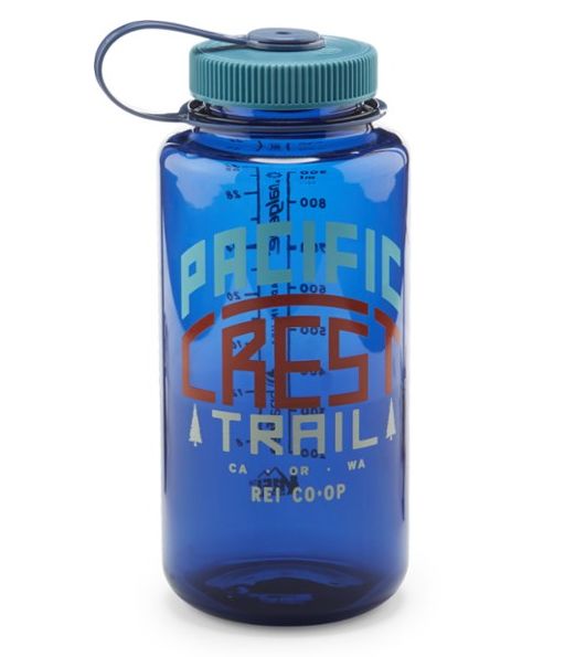 a blue glass bottle with the words pacific red trail on it's lid and handle