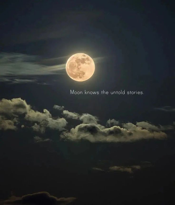 the full moon is shining brightly in the night sky with clouds and dark blue skies