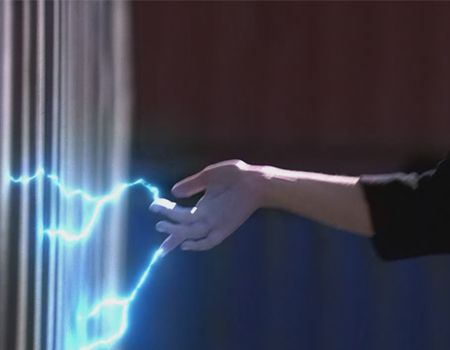 a person is touching a wall with lightning coming out of it