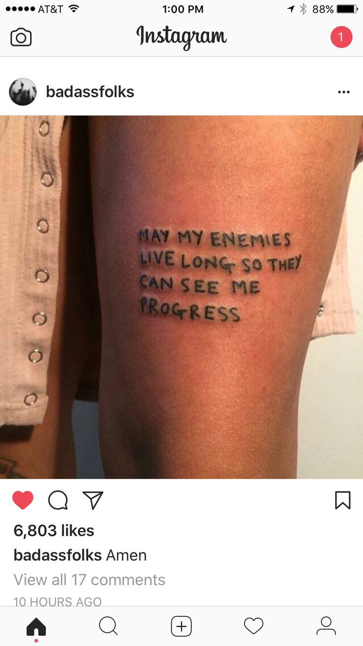 a person with a tattoo on their leg that says, may my enemies live long so they can see me progress