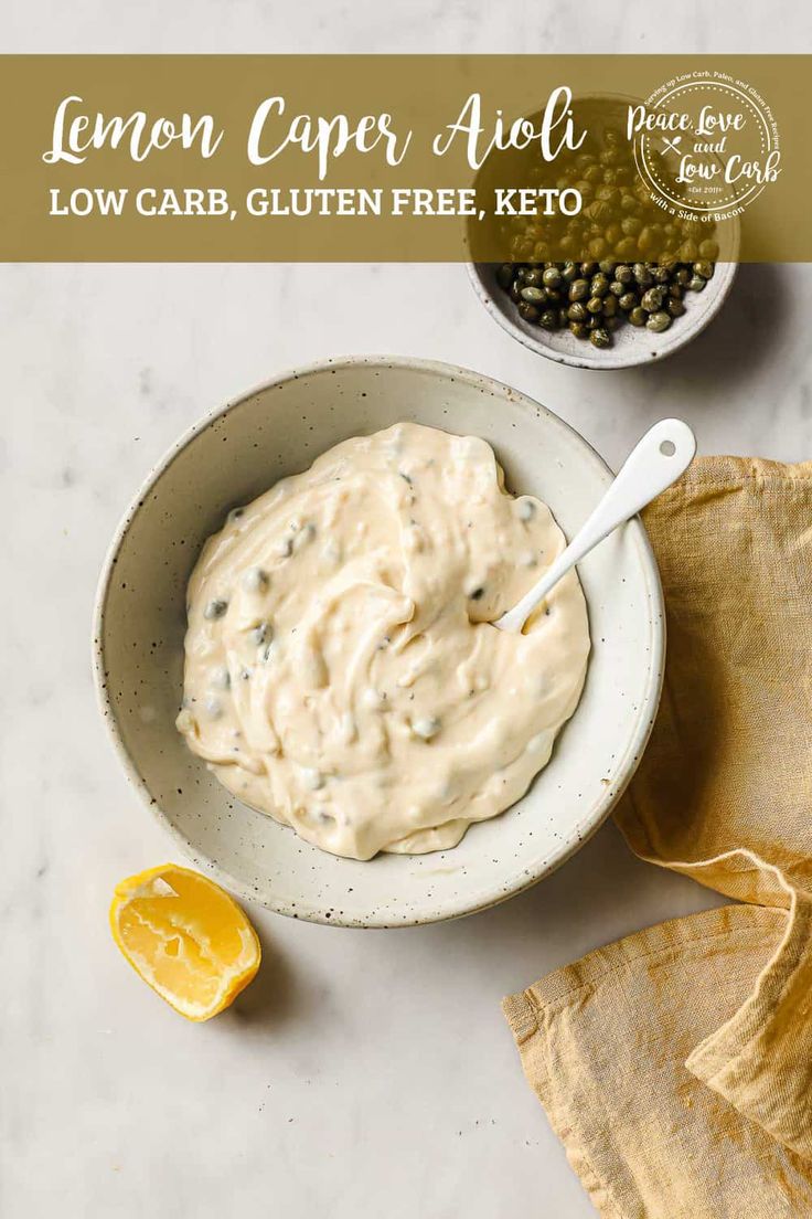 a bowl of lemon caper aioli with a spoon in it on a table