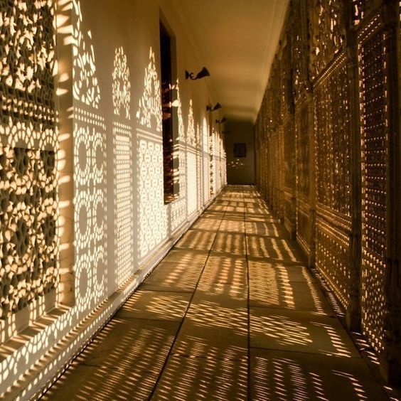 shadows cast on the walls and floor of a building