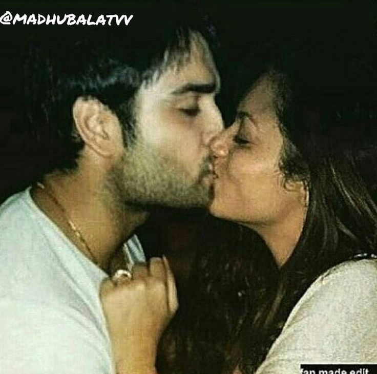 a man kissing a woman on the cheek