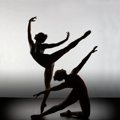 two ballet dancers in black and white pose