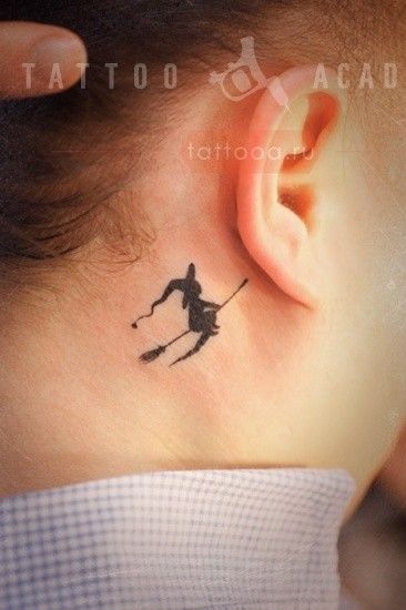 a person with a small tattoo on their ear