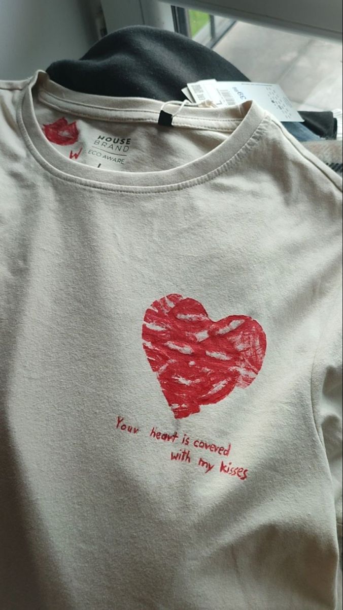 a t - shirt with a heart drawn on it