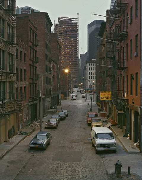 cars parked on the side of an empty street