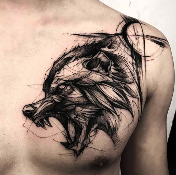 a man with a wolf tattoo on his chest