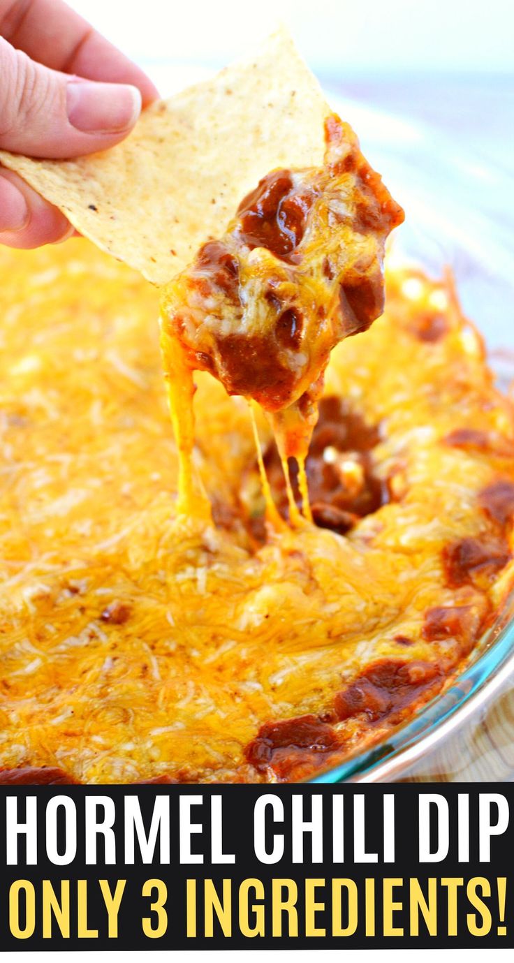 a hand holding a tortilla chip over a bowl of cheesy 3 ingredient dip