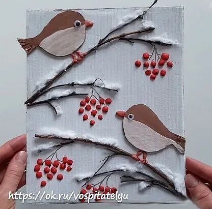 someone is holding up a piece of paper that has birds on it and berries in the branches