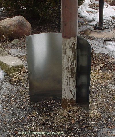 a metal object sitting on top of a pile of dirt