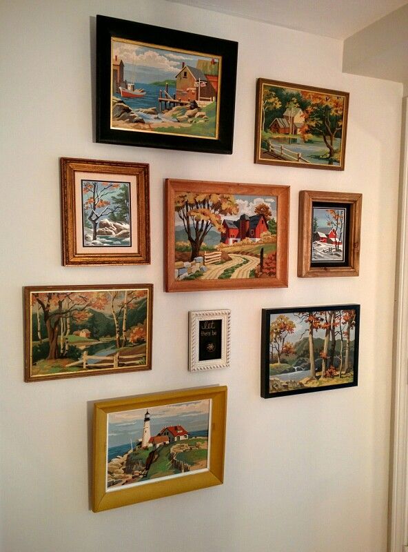 there are many paintings on the wall